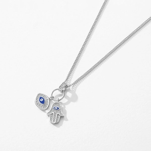Silver Hamsa Hand and Evil Eye necklace with blue enamel and zircon details