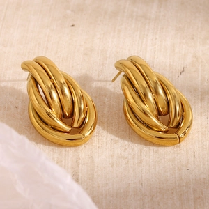 Macro shot of 18K gold plated stainless steel braided knot stud earrings detail