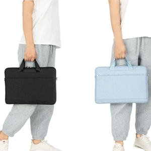 Waterproof laptop shoulder bag in black and light blue with front zipper pocket
