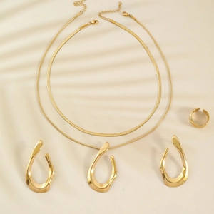 Gold stainless steel jewelry set with layered necklaces, water drop earrings and ring