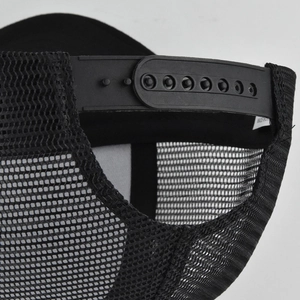 Close-up of black mesh baseball cap showing adjustable plastic snapback strap and breathable fabric