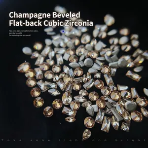 Macro detail of 50pcs champagne nail art rhinestones in various mixed geometric shapes