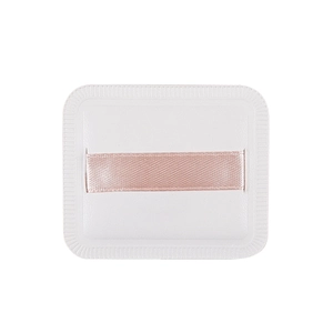 Square marshmallow cushion makeup puff in white with a pink ribbon handle for smooth application