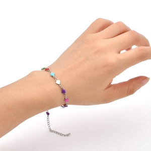 Close-up of heart enamel charms on adjustable stainless steel chain for women