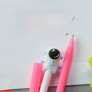 Pink astronaut gel pen with 0.5mm tip showing smooth writing on white paper