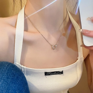 Minimalist silver faux opal necklace shown on model in soft natural sunlight