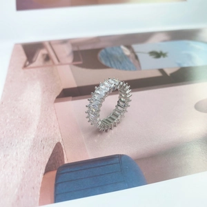 Detailed macro view of S925 sterling silver eternity ring with rectangular zirconia stones