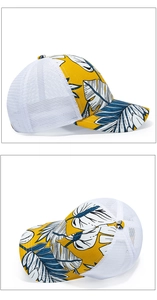 Detail view of yellow mesh trucker hat featuring blue and white tropical leaf pattern
