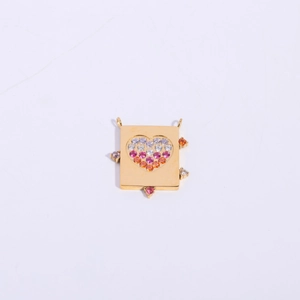 Golden rectangular pendant with a colorful gemstone heart pattern on white background
