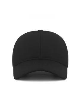 Front angle of a black winter baseball cap with ear protection and a small metal logo