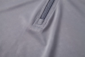 Detailed close-up of half-zip collar with reinforced stitching on men's gray UPF100+ shirt