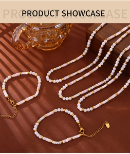 Detail of French style white and lavender beaded necklace set with gold hardware