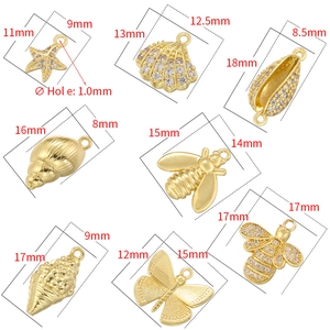 Set of 8 gold ocean and insect charms including starfish, seashells and honeybees