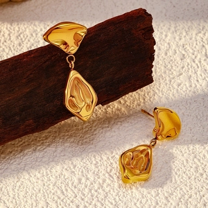 Minimalist gold stainless steel earrings with irregular lava texture and geometric design