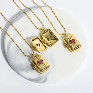 Vintage gold locket necklace with red heart zircon, showing open and closed rectangular pendant