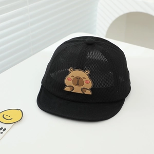 Detail of breathable mesh texture and cute capybara patch on black summer kids sun cap