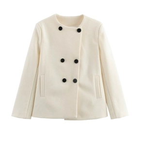 Detailed view of off-white double-breasted coat with round neck and black buttons