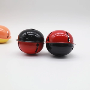 Detailed view of 4cm dual-tone red and black painted metal star cutout craft bells