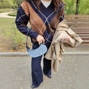 Classic plaid V-neck knit sweater with navy wide-leg jeans and denim shoulder bag