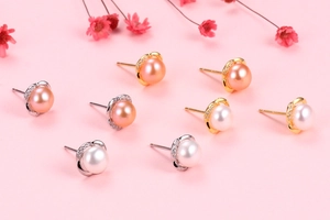 Detailed macro view of S925 silver crown earrings with natural pearls and zircons