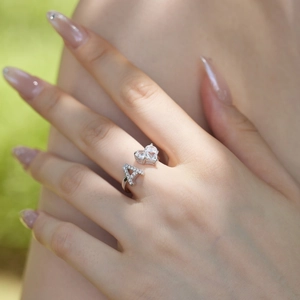 Detail of S925 sterling silver adjustable ring with zircon heart and letter A charms