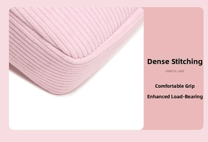 Detail of pink corduroy makeup bag showing reinforced stitching and soft fabric texture