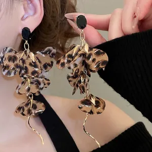 Retro leopard print fabric flower drop earrings with black gemstone and golden wave charm