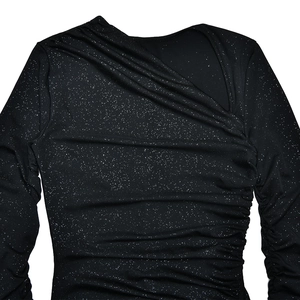 Detail of black glitter fabric showing asymmetrical draped neckline and ruched texture