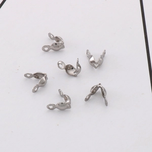 Macro detail of heart-shaped cutout stainless steel jewelry connectors for DIY