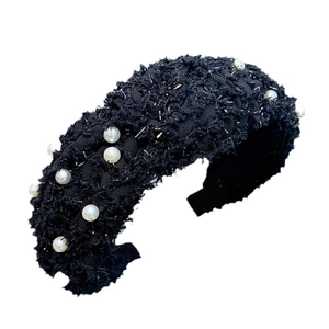 Elegant black knit wide headband with pearls and subtle silver glitter on white background
