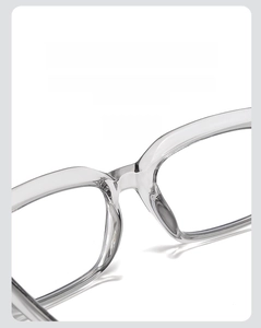 Macro detail of the integrated nose pads on transparent square frame glasses