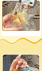 Detail of cartoon resin dog and cat keychains in individual party dog packaging