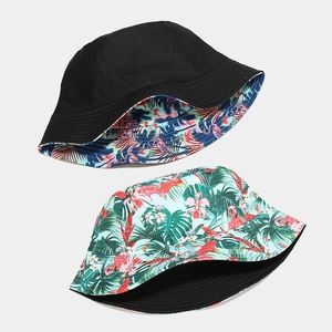 Reversible bucket hat with flamingo print and solid black side for sun protection