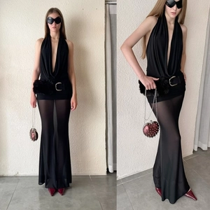 Black halter V-neck dress featuring mesh patchwork and a plush belt with silver buckle