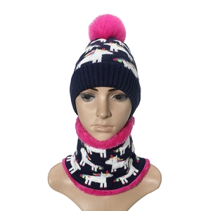 Kids winter knit set with beanie and scarf featuring unicorn patterns and faux fur poms