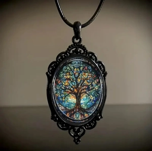 Macro shot of Gothic necklace featuring a colorful Tree of Life glass cabochon pendant