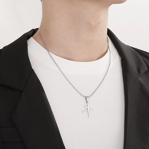 Silver stainless steel snake chain necklace with Chinese character Niu pendant on a model