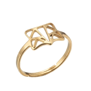 Macro view of gold geometric cut-out ring featuring a fox face design and open band