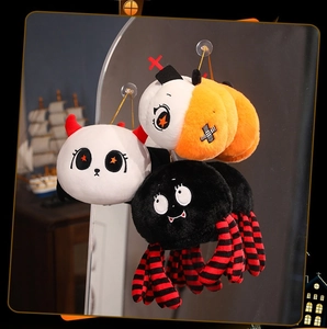 Halloween plush charms featuring ghost, pumpkin and spider attached to a mirror