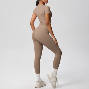 Macro detail of breathable brown yoga set featuring high-waist pants and slim-fit tee