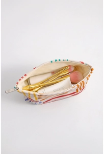 Internal view of floral corduroy makeup bag showing storage space for brushes