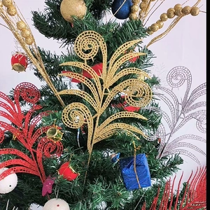 Glittery hollow Christmas leaves in gold, red and silver for festive tree decoration