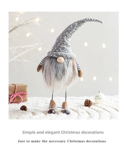 Close-up of a Nordic Christmas gnome with a grey polka dot hat and long white beard