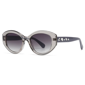Chic cat-eye sunglasses with translucent grey frames and rhinestone-encrusted temples
