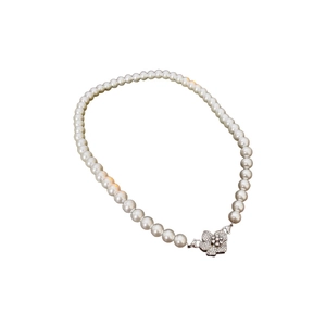 Elegant white pearl necklace with a sparkling flower clasp inlaid with zircon and rhinestones