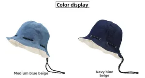 Dual-color bucket hats in medium blue and navy with adjustable drawstring details