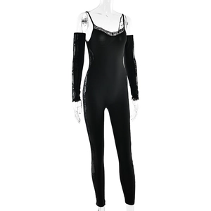 Detail of black lace bodysuit with matching long sleeves on ghost mannequin