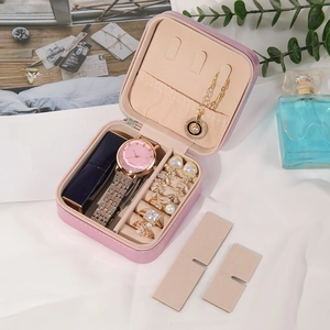 Pink portable travel jewelry box for rings and earrings with internal compartments