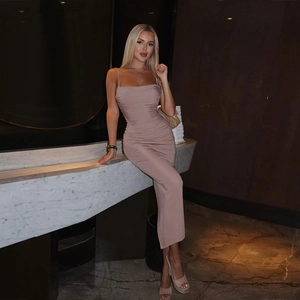 Detailed view of the gathered ruched texture on this slim fit mauve pink midi dress