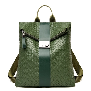 Green woven leather backpack for women with rectangular metal clasp and fabric straps